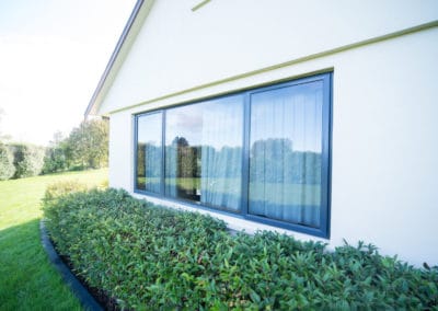 Aluminium awning and fixed windows - retrofitted with double glazing