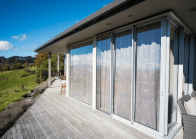 Full height aluminium windows and doors retrofitted with double glazing